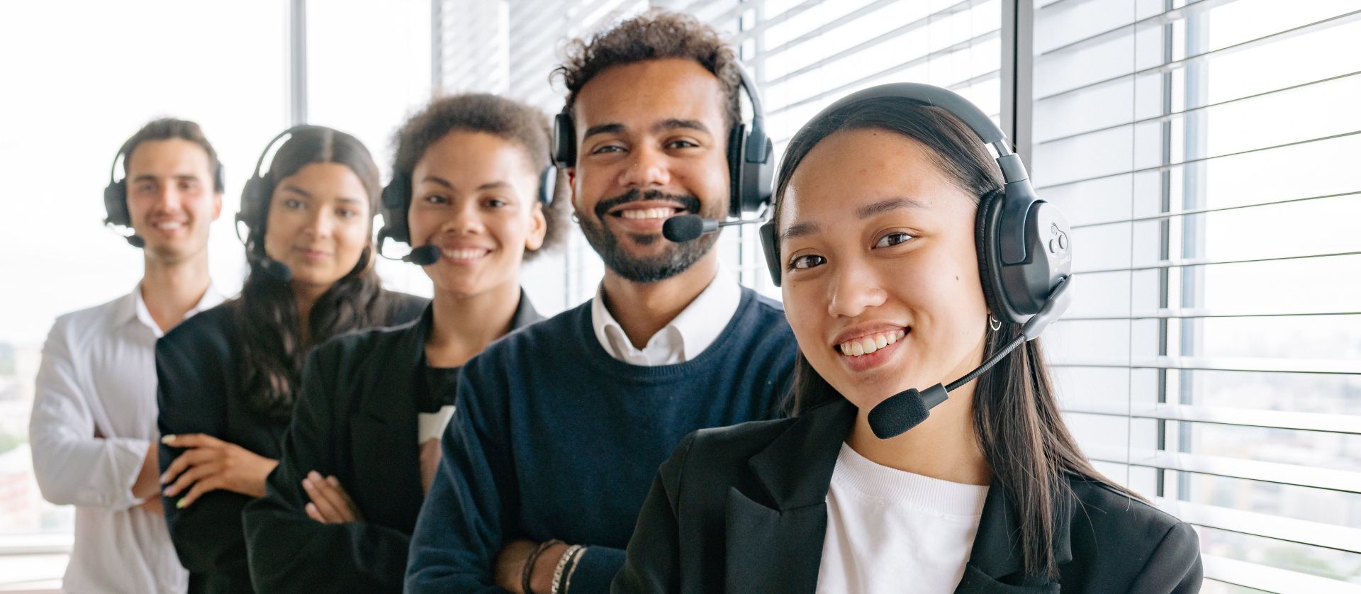 Happy Call Center Agents Looking at Camera
